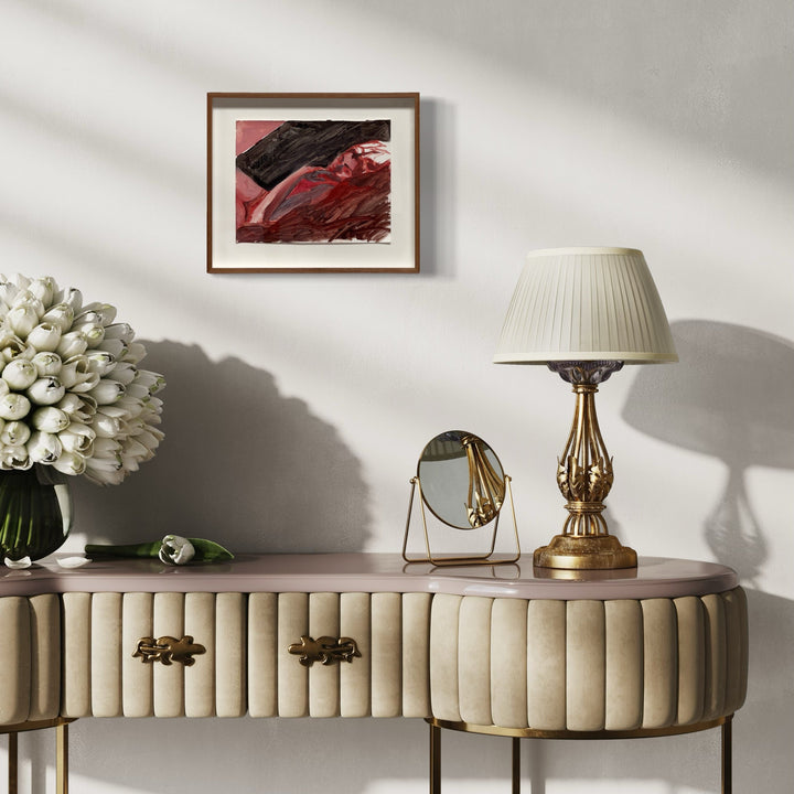 The artwork 'Red Stare' by Jillian Shea features bold abstract brushstrokes in deep crimson and black hues. The oil painting on paper displays dramatic movement through sweeping gestural marks, creating a dynamic interplay of dark and light elements, professionally presented in a custom brown frame. Original artwork by Jillian Shea.