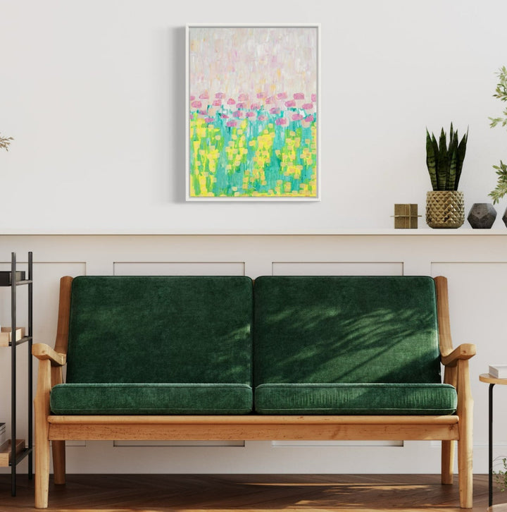The artwork 'la vie en rose, no.2 (ode to claude)' by Taylor Binda features an abstract impressionist composition with vibrant yellow and turquoise brushstrokes in the lower portion, transitioning to delicate pink and cream hues above, creating a dreamy, meadow-like landscape effect in acrylic on watercolor paper, framed in white.