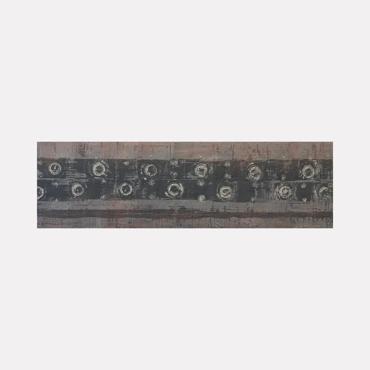 The artwork 'Vault Lights (Treads & Risers-1)' by Cora Jane Glasser features horizontal bands of weathered gray and muted brown tones with circular patterns resembling aged vault lights. Created in encaustic and oil on birch panel, the piece displays textural elements and industrial-inspired geometric forms arranged in a linear composition measuring 9x30 inches.