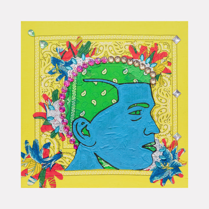 The artwork 'Blue Barbershop 4' by Marco DaSilva features a vibrant profile portrait in bright blue against a yellow background, adorned with colorful floral elements in red and blue. The figure wears a green cap decorated with white teardrop shapes and pink rhinestone trim. Mixed media elements include silver foil doilies, bandana fabric, and marker details creating a dynamic urban art aesthetic. - Marco DaSilva