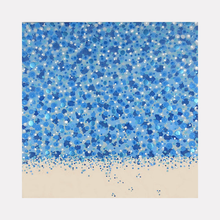 The artwork 'Cascade' by Eric Jiaju Lee features a mesmerizing pattern of blue dots and circles scattered across the canvas, reminiscent of falling water or snow. The composition transitions from a dense cluster of varying blue hues at the top to scattered dots cascading onto a cream-colored base, creating a dynamic waterfall effect. Created in acrylic on canvas, 36x36 inches, by Eric Jiaju Lee.