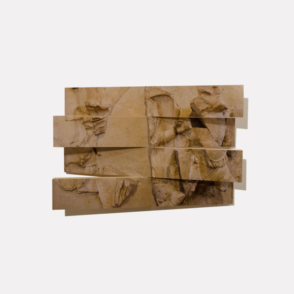 The artwork 'Hera Metope Dissected' by Ryan Frank features a deconstructed classical relief sculpture divided into horizontal wooden segments. The sepia-toned photograph captures ancient Greek architectural details, showing fragmented drapery and sculptural forms in a warm beige palette. The piece combines traditional photography with contemporary presentation, measuring 12x18 inches. By Ryan Frank.