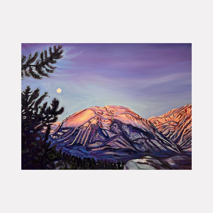 The artwork 'Moon Cradled by the Pines' by Claudia Robles-Gil captures a majestic mountain landscape at dusk, with snow-capped peaks illuminated in warm salmon-pink alpenglow. Dark silhouetted pine trees frame the foreground, while a full moon hangs in the purple-blue twilight sky. The oil and acrylic painting showcases dramatic light effects and textural brushwork across the mountainous terrain.