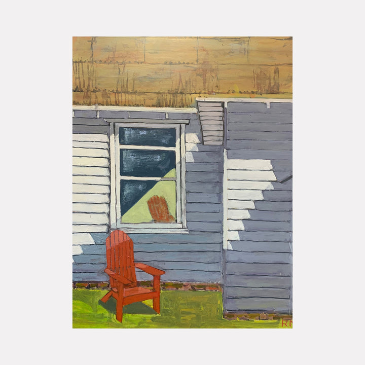 The artwork 'Orange Cottage' by Roger McErlane depicts a rustic scene with a weathered blue-gray clapboard exterior wall, featuring a white-trimmed window and an orange Adirondack chair on a green lawn. The composition captures warm evening light with golden sky tones, showcasing strong architectural angles and pastoral charm. Oil on canvas by Roger McErlane.