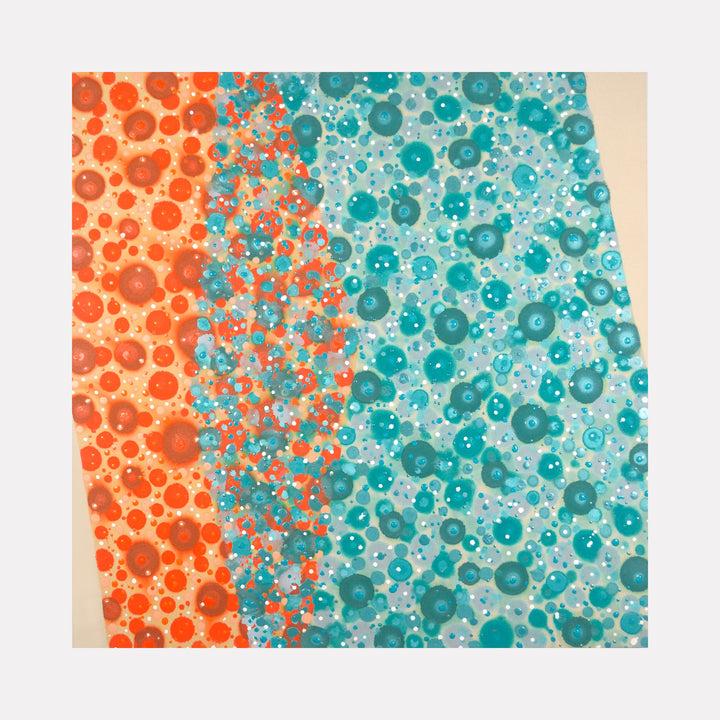 The artwork 'Pas de Deux' features a dynamic composition of floating circular forms in vibrant coral orange and turquoise blue, creating a fluid, bubble-like pattern across the canvas. The circles vary in size and opacity, merging and overlapping in the center to create a graceful transitional zone. The abstract pattern evokes a sense of underwater movement. Acrylic on canvas by Eric Jiaju Lee.
