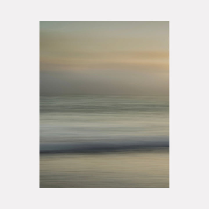 The artwork 'Sacred Cove' by Neil Shapiro features an abstract seascape rendered in soft, horizontal brushstrokes. Muted tones of sage green, beige, and pewter gray blend seamlessly, creating a dreamy, ethereal atmosphere. The composition suggests a tranquil shoreline at dusk, with gentle waves reflecting diffused light on textured Hahnemühle paper.