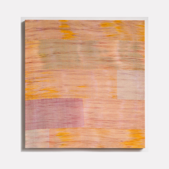 The artwork 'Untitled 101' by Victoria Manganiello features a textural abstract composition in soft peach and mauve tones with vibrant yellow accents. Horizontal bands of woven fibers create a subtle geometric pattern, showcasing natural and synthetic materials dyed in warm sunset hues, measuring 32 by 30 inches.