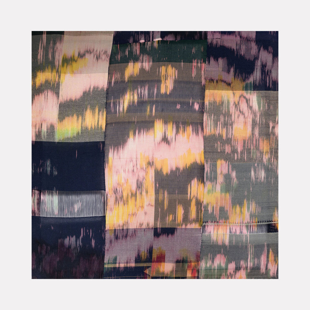 The artwork 'Untitled 53' by Victoria Manganiello features abstract textile patterns with blurred, watercolor-like effects in pink, yellow, and deep navy. The composition shows segmented blocks with distressed vertical striations, creating a dreamy, impressionistic quality. Natural and synthetic fibers blend seamlessly, with dye variations creating depth and movement across the 52-inch square canvas.