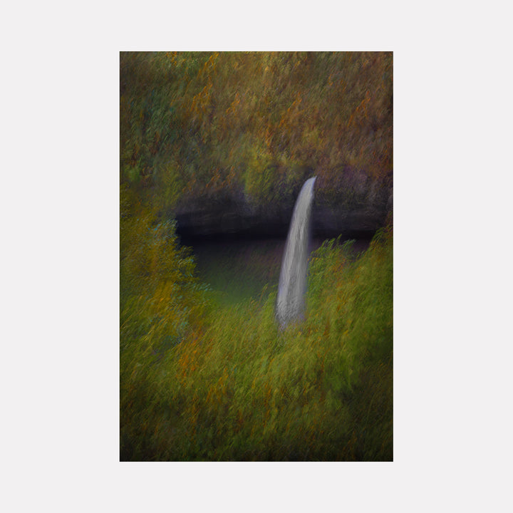 The artwork 'Waterfall in Oregon' by Neil Shapiro captures a misty waterfall cascading from dark rocky cliffs, surrounded by impressionistic autumn foliage in golden yellows and deep greens. The soft-focus technique creates a dreamy, painterly effect, with the white waterfall providing dramatic contrast against the moody, emerald pool below. Printed on textured Hahnemuhle paper.