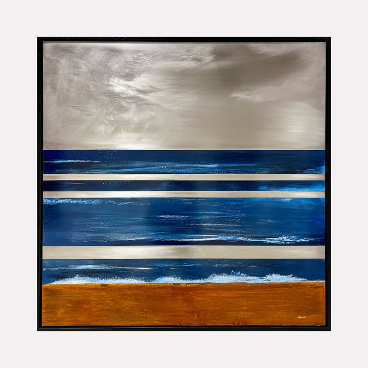 The artwork 'Where Land Meets Sky IV#1' by Nicki Adani features horizontal bands of deep ocean blues and rich copper-brown, separated by metallic silver stripes on steel. The composition evokes a minimalist seascape with a moody grey sky, creating a striking abstract interpretation of a coastal horizon. Mixed media on steel, the piece combines textural elements with smooth metallic surfaces.
