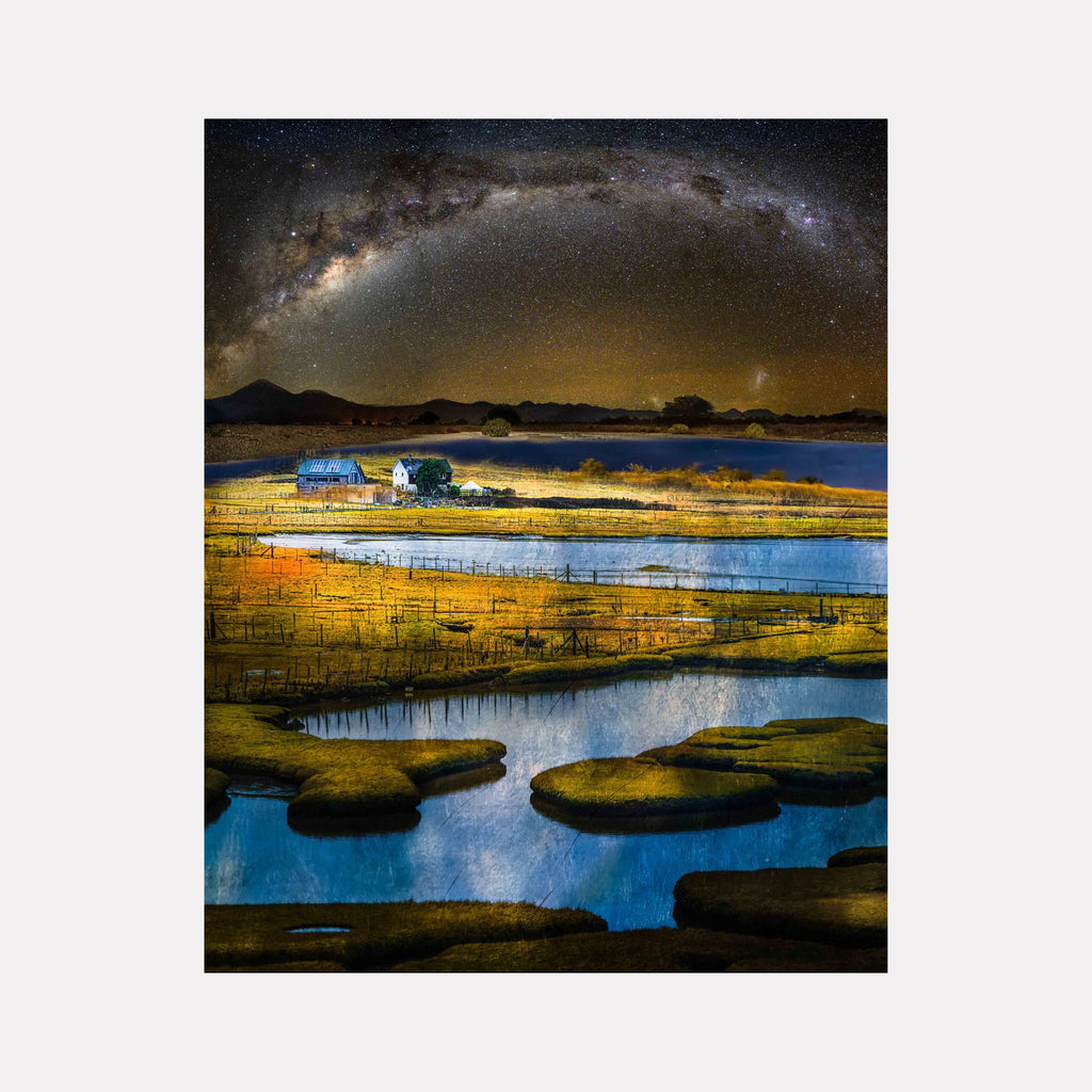 Stand #4 by Gordon Saperia depicts a luminous rural landscape with reflective waterways winding through golden fields, a farmhouse nestled amidst serene hills, and a vast starry sky arching above, blending tranquil natural beauty with celestial wonder in this Curina art piece.