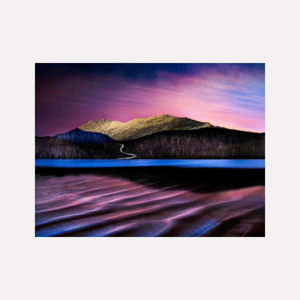 Stand #1 by Gordon Saperia showcases a serene landscape with a winding road leading to sunlit mountains under a vibrant twilight sky, reflected on rippled water, blending natural beauty and tranquil tones in a captivating Curina art piece.