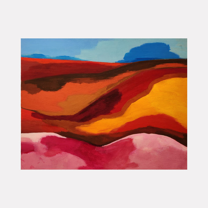 The artwork 'Trip One' by Joanie Flickinger features an abstract landscape with undulating hills in vibrant warm hues of red, orange, and pink against a soft blue sky. The acrylic gouache painting showcases bold, flowing curves and layered color transitions, creating a dreamlike desert vista on cotton paper mounted to wood panel. By Joanie Flickinger.