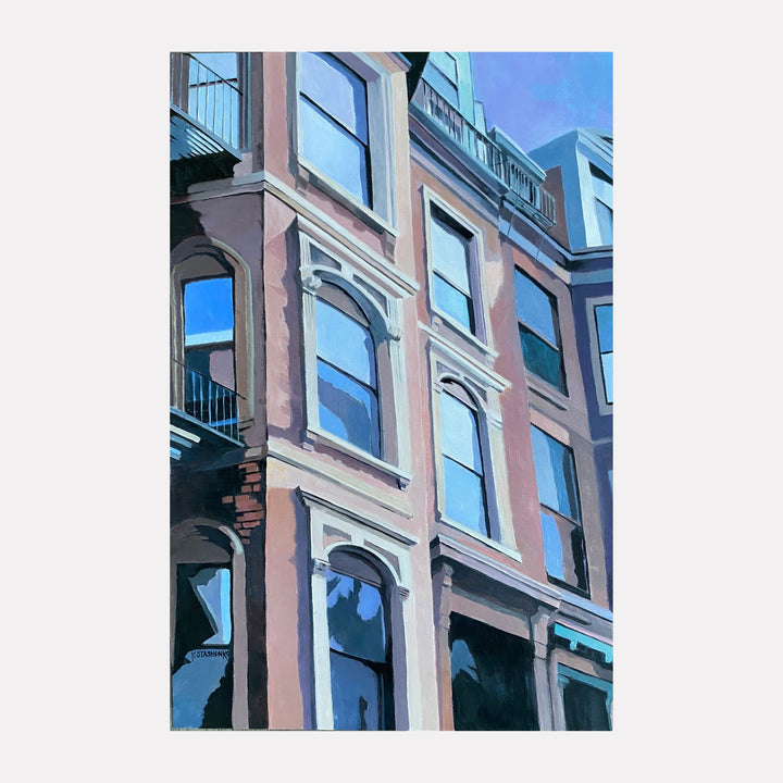 Windows Over Boston by Kristin Stashenko captures a detailed view of classic urban architecture with warm brick facades and large reflective windows under a clear blue sky, evoking a peaceful morning in the city through its soft color palette and interplay of light and shadow.