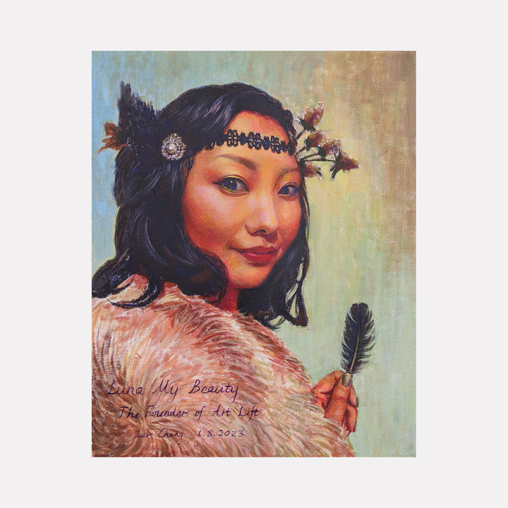 Luna My Beauty by Ler Chang features a serene portrait of a woman adorned with a delicate floral and jeweled headband, holding a black feather. The warm tones and subtle textures highlight her calm expression against a softly muted background, evoking themes of grace, nature, and quiet strength.
