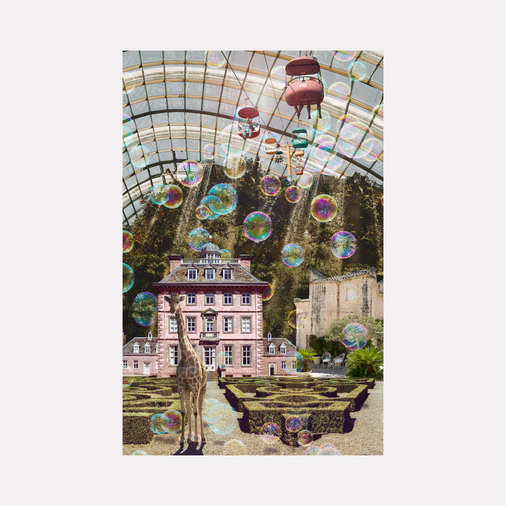 Sky Garden by Nash Bellows presents a whimsical scene with a tall giraffe standing amid a manicured garden maze in front of an elegant historic mansion. Giant iridescent soap bubbles float upward beneath a glass canopy, casting prismatic light over the vivid, imaginative indoor landscape.
