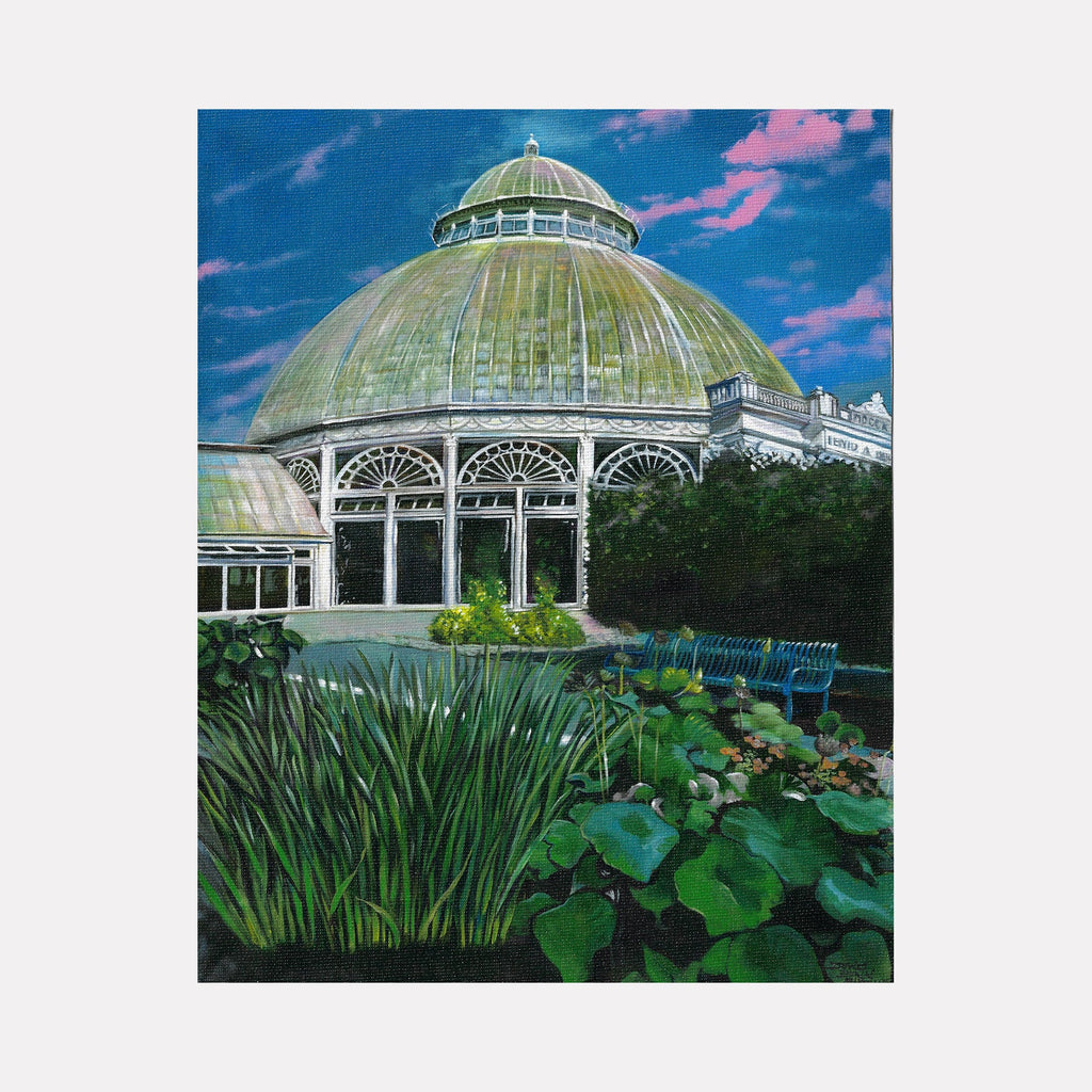 The artwork "New York Botanical Garden (The Bronx)" by David Bunn Martine features a detailed architectural painting of a large domed greenhouse with intricate white tracery set against a vivid, deep blue sky with pink clouds. Lush green foliage in the foreground contrasts with the structured forms, evoking the precise realism and vibrant color seen in works by Edward Hopper and the serene botanical focus reminiscent of Georgia O’Keeffe.