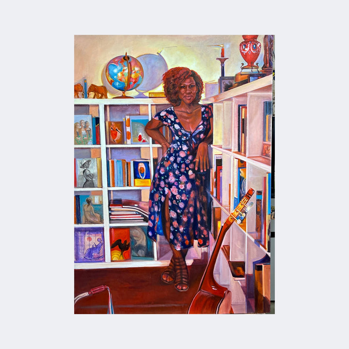The artwork "Censure with Maya and Alice" by Regina Miele depicts a woman with curly hair in a floral dress standing confidently in a warmly lit room surrounded by white bookshelves filled with books, globes, vases, and framed art. The style combines realism with vibrant, detailed textures reminiscent of Kehinde Wiley’s portraiture and the intimate domestic scenes of Mary Cassatt. A guitar rests in the foreground, adding a musical element to the 