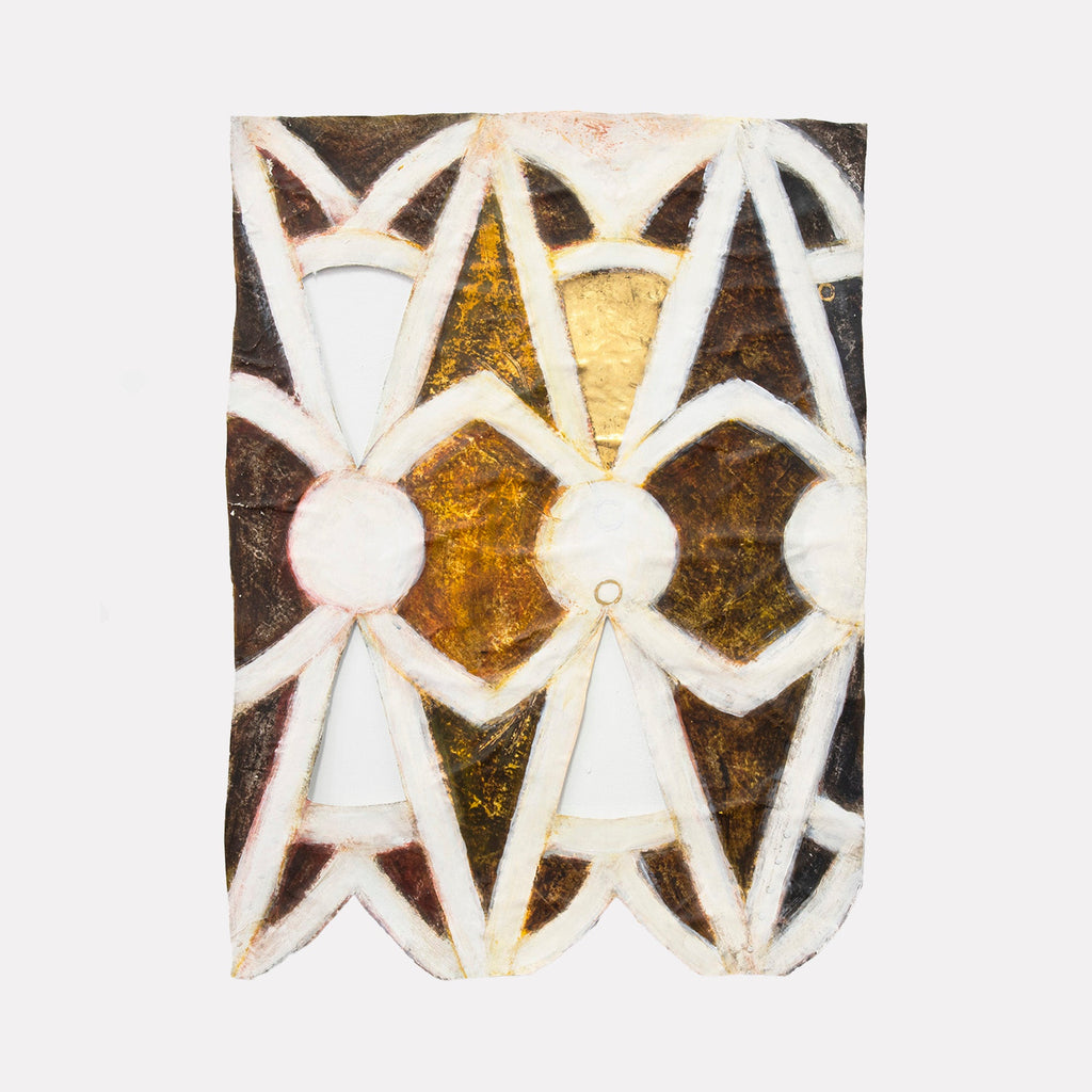 The artwork "Atrium West" by Adina Andrus features a textured, sculptural composition with repeating geometric shapes resembling stylized human figures in warm earth tones of ochre, brown, and cream. The layered, tactile surfaces evoke a primitive, abstract aesthetic reminiscent of works by Pablo Picasso and the rhythmic patterning found in Paul Klee’s art.