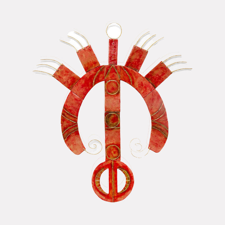 The artwork "This Is Not a Tomato" by Adina Andrus features a sculptural composition in vibrant orange-red hues with curved, segmented forms radiating from a central vertical piece. Textured metal and delicate wire elements create an abstract, organic shape, evoking the surreal abstraction and playful energy found in works by Alexander Calder and Joan Miró.