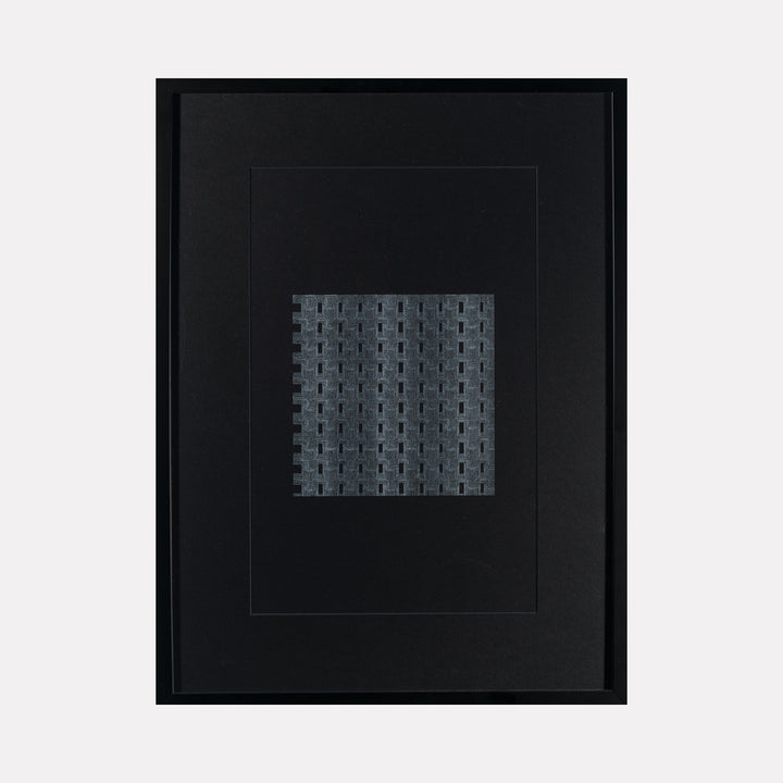 Algorithmic Textures (#9) by Craftwork features a framed abstract artwork with a grid of textured gray blocks on a deep black background, presenting a minimalist, modern exploration of pattern, depth, and subtle geometric repetition in contemporary art.