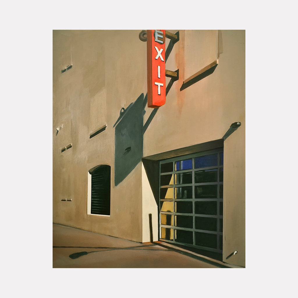 EXIT by Allan Gorman portrays a quiet urban corner featuring a stark red EXIT sign casting shadows on a beige building. The composition contrasts light and shadow with clean architectural lines, evoking a thoughtful moment of stillness within a minimalist cityscape.