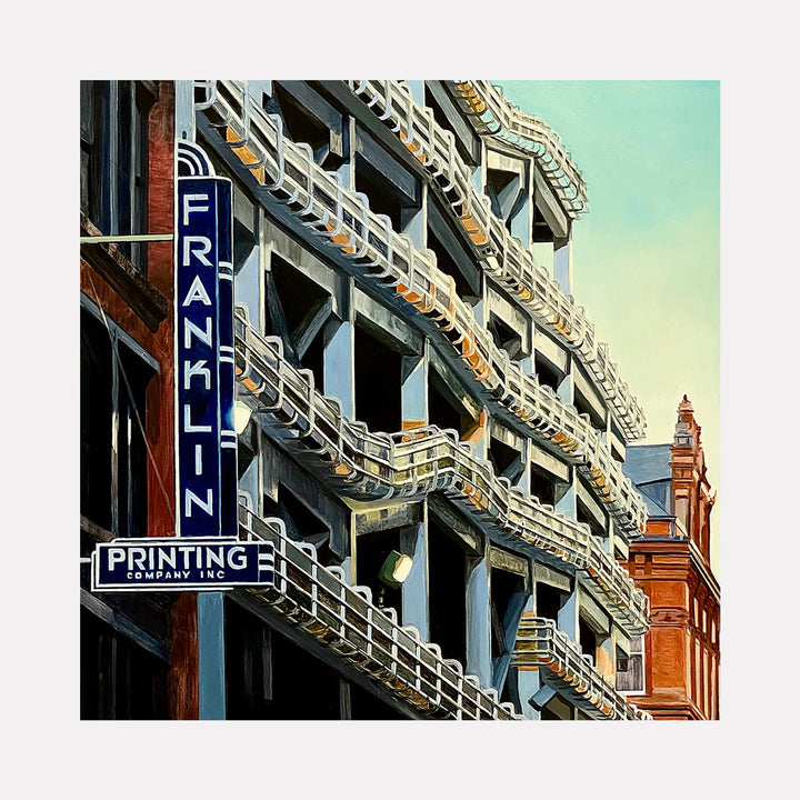Franklin by Allan Gorman presents a detailed urban scene focusing on the geometric patterns of a concrete parking structure with prominent white railings. The composition contrasts the cool gray tones with the warm brick facade and a distinctive vertical blue sign reading Franklin, evoking industrial modernity in a vibrant cityscape.