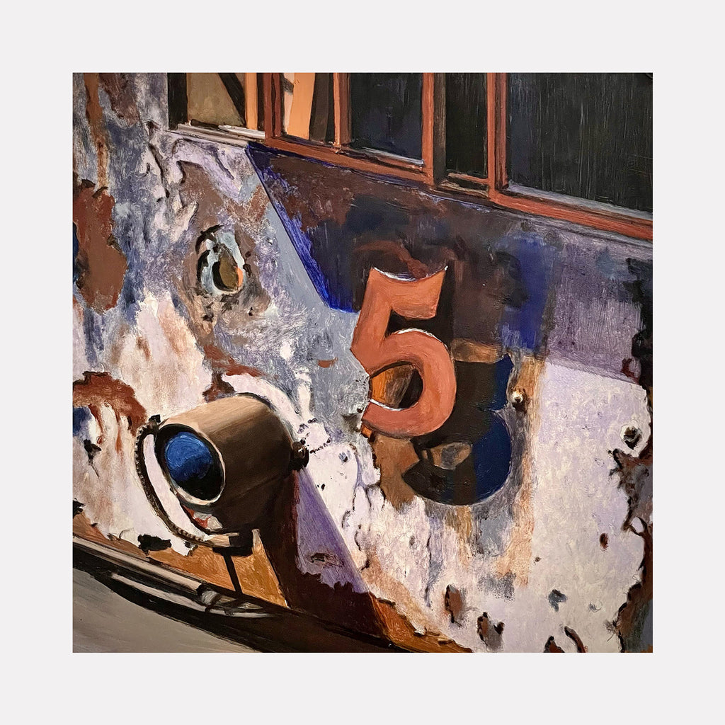 They Don’t Run Ol’ #5 No Mo by Allan Gorman captures a weathered close-up of a rusted metal surface with peeling paint, prominently featuring a bold number 5 and an old spotlight. The composition highlights textures and aged industrial character, evoking a nostalgic yet contemplative urban atmosphere through earthy and muted tones.