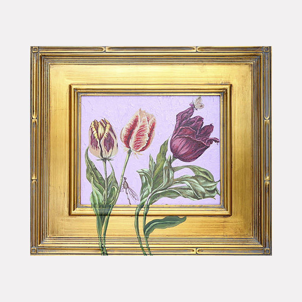 The artwork "An Imaginary Line" features three detailed tulips with green leaves against a textured light purple background, framed by an ornate gold frame with intricate patterns. The tulips have varying shades of pink, purple, and cream with delicate veining and subtle highlights, creating a realistic and elegant composition. Carlos Gamez de Francisco