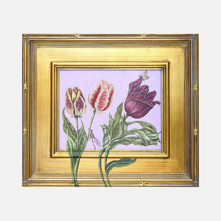The artwork "An Imaginary Line" features three detailed tulips with green leaves against a textured light purple background, framed by an ornate gold frame with intricate patterns. The tulips have varying shades of pink, purple, and cream with delicate veining and subtle highlights, creating a realistic and elegant composition. Carlos Gamez de Francisco