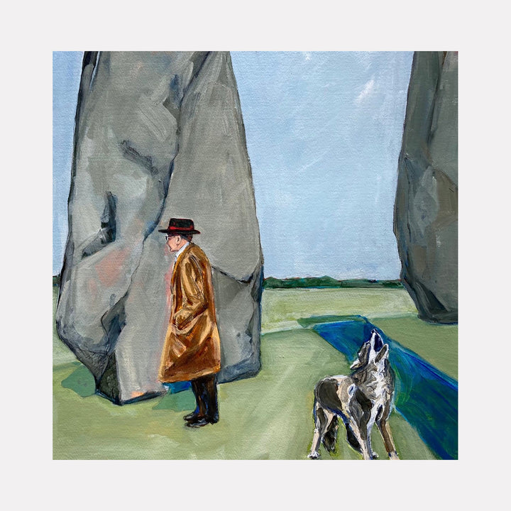 The artwork "An Unremarkable Day" by Jo Carol Mitchell-Rogers depicts a solitary man in a brown coat and black hat standing between two large, abstract stone monoliths reminiscent of minimalist landscapes. A wolf-like dog stands nearby on a green field with a narrow blue stream under a pale, overcast sky. The style evokes elements of Edward Hopper's quiet realism and early 20th-century surrealism.
