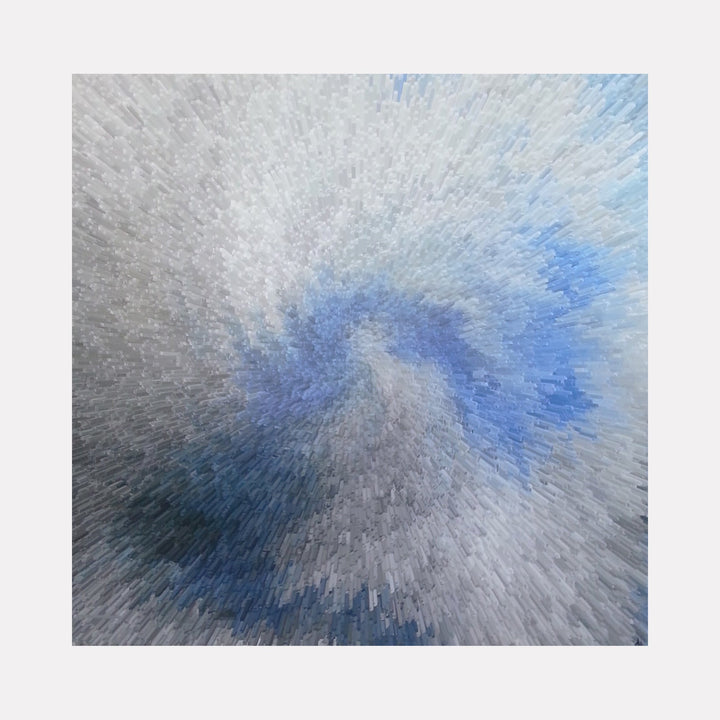 The artwork "Torro Recycled ii" by Anne Cherubim features an abstract composition with a dynamic swirl of three-dimensional rectangular blocks in shades of blue, gray, and white. The textured, pixelated effect evokes a sense of motion and depth, reminiscent of pointillism and digital glitch art, blending organic flow with modern geometric abstraction.