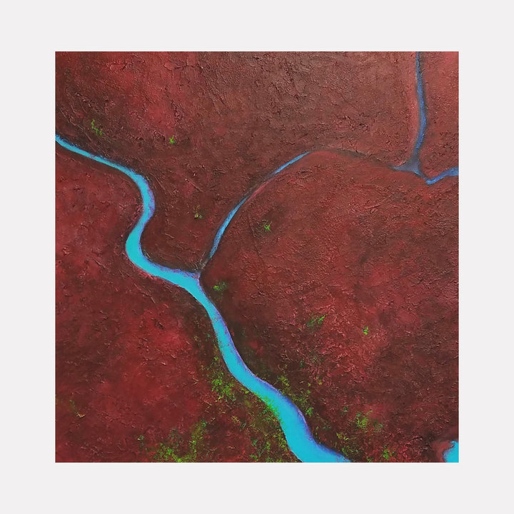 The artwork "51 Square Miles" features a textured abstract landscape with deep red and earthy brown tones, intersected by vibrant, winding blue lines resembling rivers or pathways. Small green patches add contrast and depth, highlighting the naturalistic style. Created by Anne Cherubim.