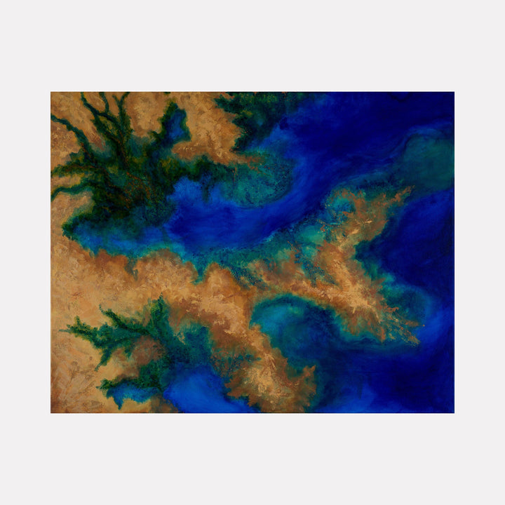 The artwork "I’m Standing Here" features an abstract aerial view of land and water with rich textures and vibrant hues of deep blue, turquoise, green, and warm sandy browns, creating a dynamic natural landscape impression. The piece emphasizes fluid shapes and color gradients, by Anne Cherubim.
