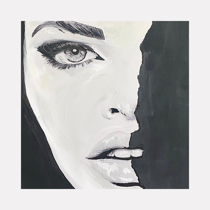 The artwork "Black and White" by Claudia Sauter in gallery position 1 showcases a powerful monochrome portrait of a woman's face partly obscured by a deep black shadow. The smooth yet textured brushstrokes emphasize her reflective eye and softly parted lips, combining the chiaroscuro drama of Caravaggio with the bold graphic style of Kathe Kollwitz.