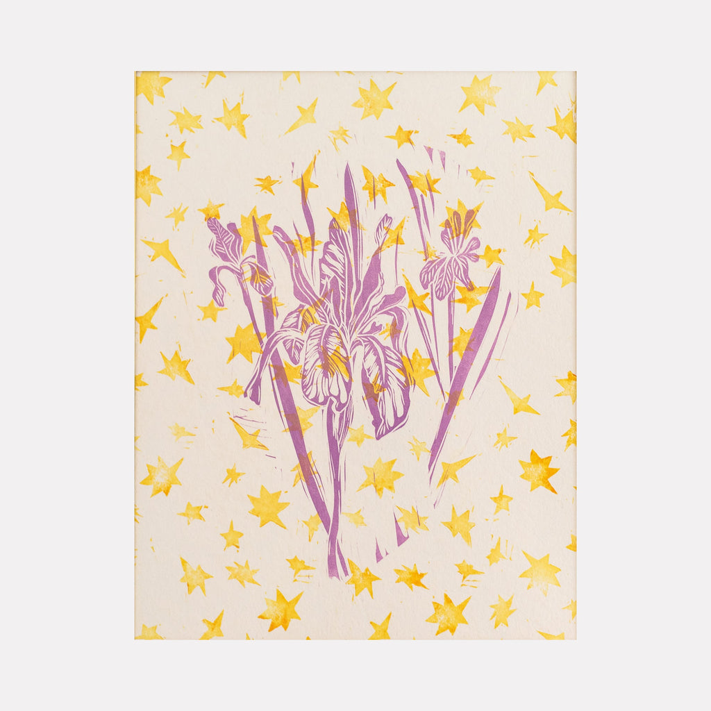 The artwork "Betty" features a central bouquet of stylized purple irises with intricate line details, set against a light beige background adorned with scattered yellow star shapes. The piece combines natural floral elements with abstract star patterns, creating a harmonious blend of organic and geometric forms. By Ashley Ranae Quick.