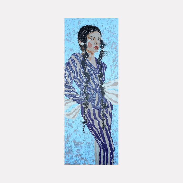 The artwork "Blue Fashion" features a stylized portrait of a woman with long dark braided hair against a textured light blue background. She wears a striking blue and purple striped outfit with voluminous white sleeves, blending modern fashion elements with artistic brushstrokes and a slightly abstract style. Carlos Gamez de Francisco.