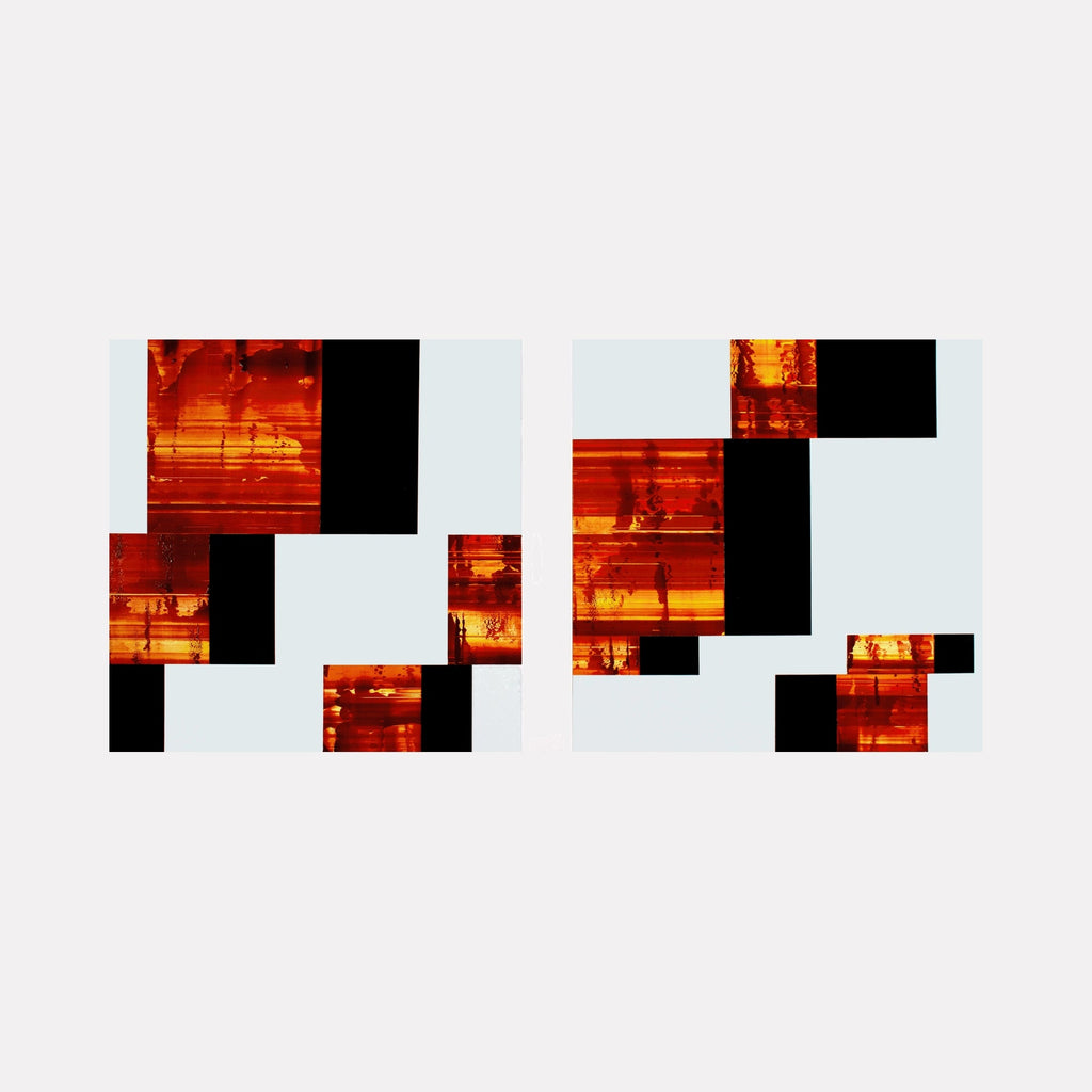 The artwork "Burn & Lap 01" by John Cox features an abstract composition with a grid of fragmented rectangular shapes in fiery red and orange hues contrasted against deep black blocks, set on a pale background. The bold geometric arrangement and layered textures evoke the modernist abstraction of Kazimir Malevich and the dynamic color contrasts reminiscent of Mark Rothko's later works.