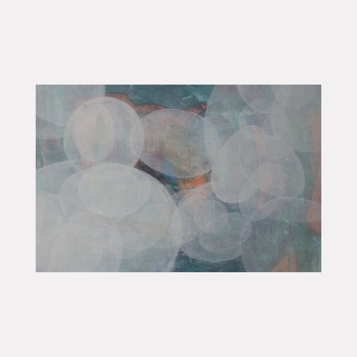 The artwork "Meditation Set 7.25" by Carin Kulb Dangot features an abstract composition of translucent overlapping oval shapes in soft blues, grays, and muted oranges set against a textured, cold-toned background. The ethereal layering and subtle color transitions evoke the serene abstraction of Mark Rothko and the contemplative depth found in Agnes Martin’s minimalist works.