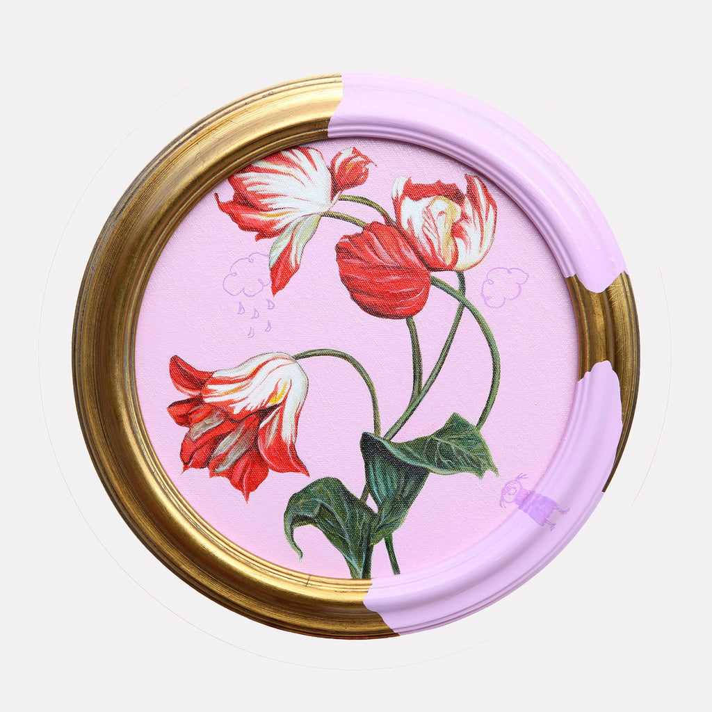 The artwork "A Gentle Breeze II" by Carlos Gamez de Francisco features a circular frame partially painted in soft lavender and antique gold, enclosing three detailed red and white tulips with green leaves on a pastel pink background. The delicate botanical illustration blends classical still life with subtle whimsical elements, evoking a balance of nature and modern minimalism reminiscent of Georgia Oâ€™Keeffeâ€™s floral focus and the refined palette