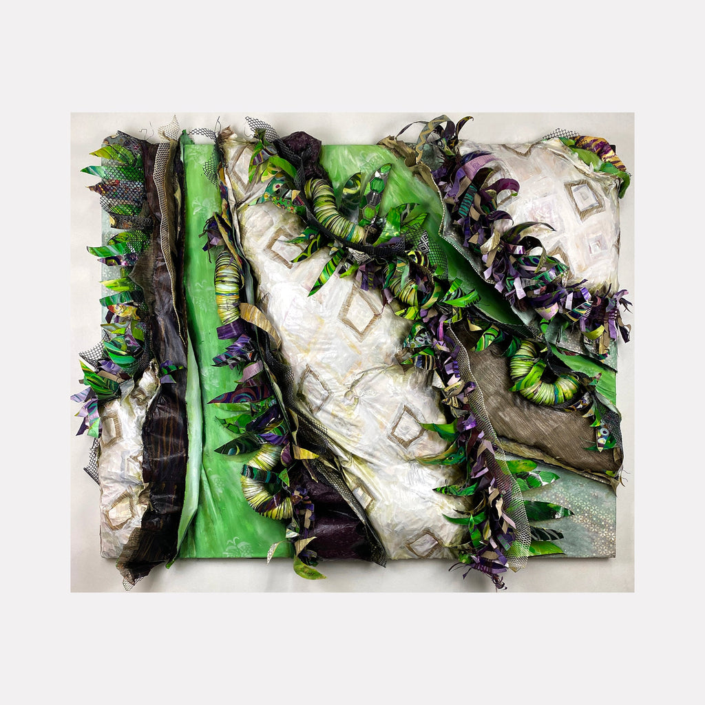 The artwork "Crafty Collaboration 9" by Christina Massey features layered, textured fabric with prominent green, white, and purple hues, incorporating curling and folded elements that create a dynamic, three-dimensional effect. The abstract composition evokes the tactile qualities seen in works by artists like Christo and Jeanne-Claude.