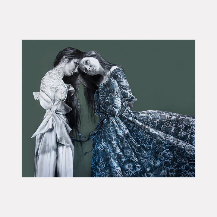 The artwork "DO NOT MAKE ME BLUE" by Lisyanet Rodriguez features two ethereal female figures rendered in detailed mixed media, set against a muted green background. One figure wears a flowing white gown with delicate floral textures, while the other dons a voluminous blue lace dress with intricate patterns. The surreal, introspective mood and fine realism evoke the emotive portraits of Frida Kahlo and the delicate psychological narratives found i