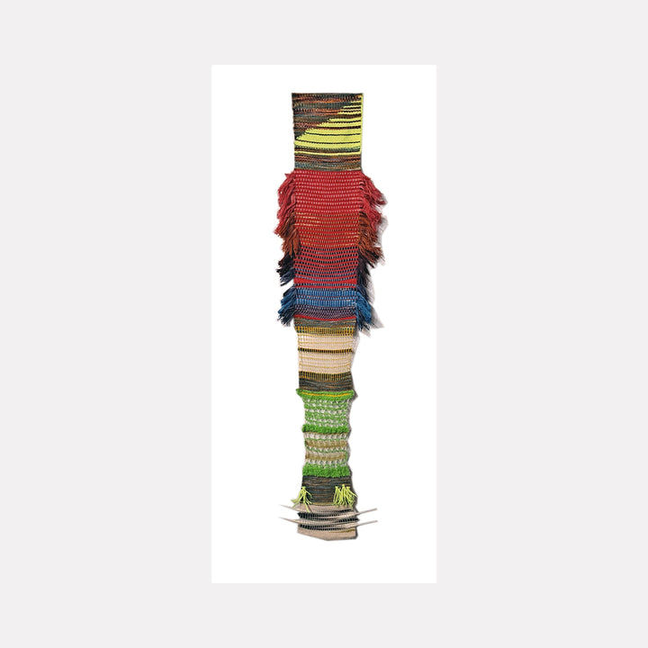 Daily Meditations, Oct to Nov 2023 by Johanna Ryan features a vertical woven tapestry with distinct color blocks transitioning from yellow to red, blue, and green. The textural piece incorporates upcycled yarn and feathers, creating layered fringed sections and intricate woven patterns that form a striking contemporary fiber art composition, measuring 44x75 inches.