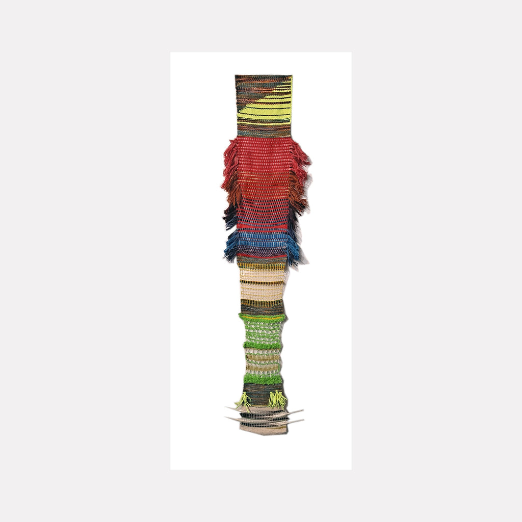 Daily Meditations, Oct to Nov 2023 by Johanna Ryan features a vertical textile weaving with distinct color bands of yellow, red, blue, and green, incorporating upcycled yarn and feathers. The piece showcases textural fringe elements and striped patterns, creating a totem-like composition against white background. 44x75 inches handwoven artwork.