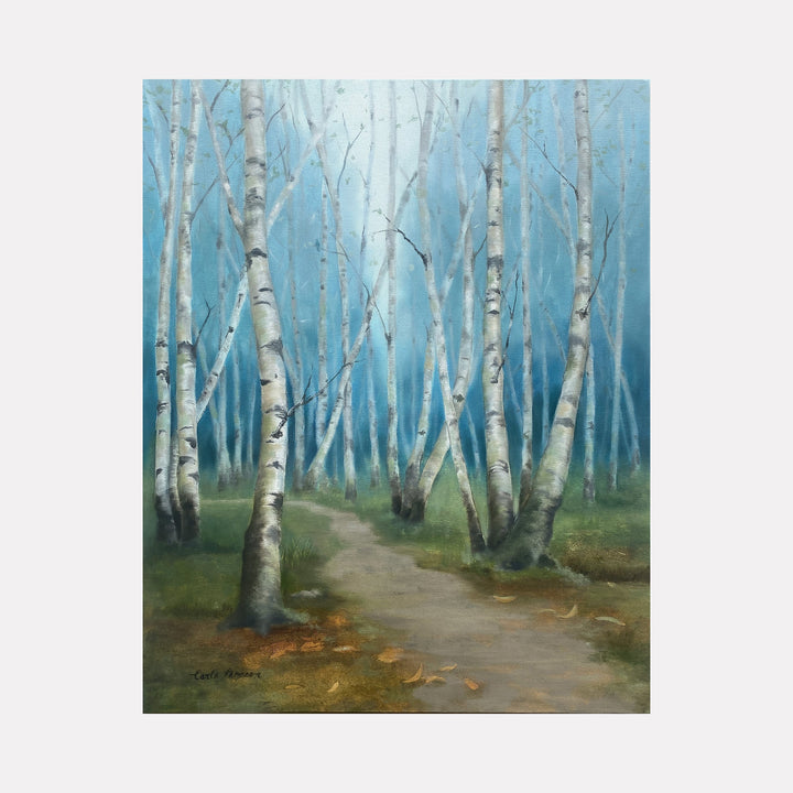 The artwork "Direction Unclear" by Carla Thomson depicts a misty forest path winding through slender birch trees with white bark marked by dark horizontal lines. The scene features soft greens and earthy browns on the forest floor, contrasted with a cool, diffused blue sky background. The style evokes the atmospheric landscapes of artists like Caspar David Friedrich, blending realism with a dreamy, contemplative mood.