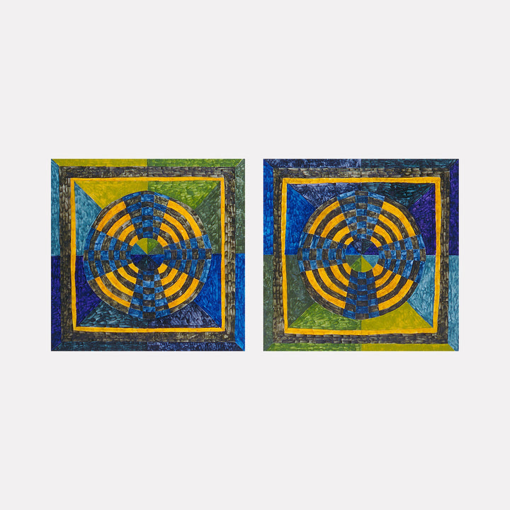 The artwork "EYE WHEEL" by Barbara Ellmann features two square panels side by side, each containing a concentric circular pattern of alternating blue and yellow segments radiating from a central point. The textured, layered colors include deep blues, greens, and yellows, evoking the geometric abstraction of Frank Stella and the vivid color contrasts found in Sonia Delaunayâ€™s works.