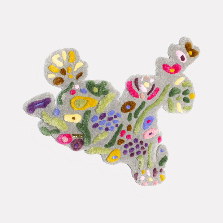 The artwork "Flower Arrangement" by Abigail Henthorne features an abstract cluster of organic shapes with soft textures in muted greens, purples, yellows, pinks, and browns on a neutral background. The flowing, biomorphic forms evoke the playful abstraction of Joan Miró and the tactile realism found in the works of Jean Dubuffet.