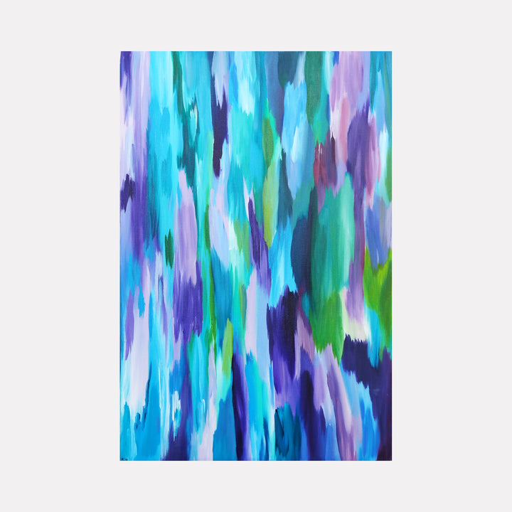 The artwork "Fluid Emotions" by Kim Rosebud features an abstract composition with vertical, flowing brushstrokes blending various shades of blue, teal, purple, and green. The texture appears smooth yet dynamic, reminiscent of the fluidity found in works by artists like Helen Frankenthaler and Gerhard Richter, evoking a serene and emotional atmosphere.