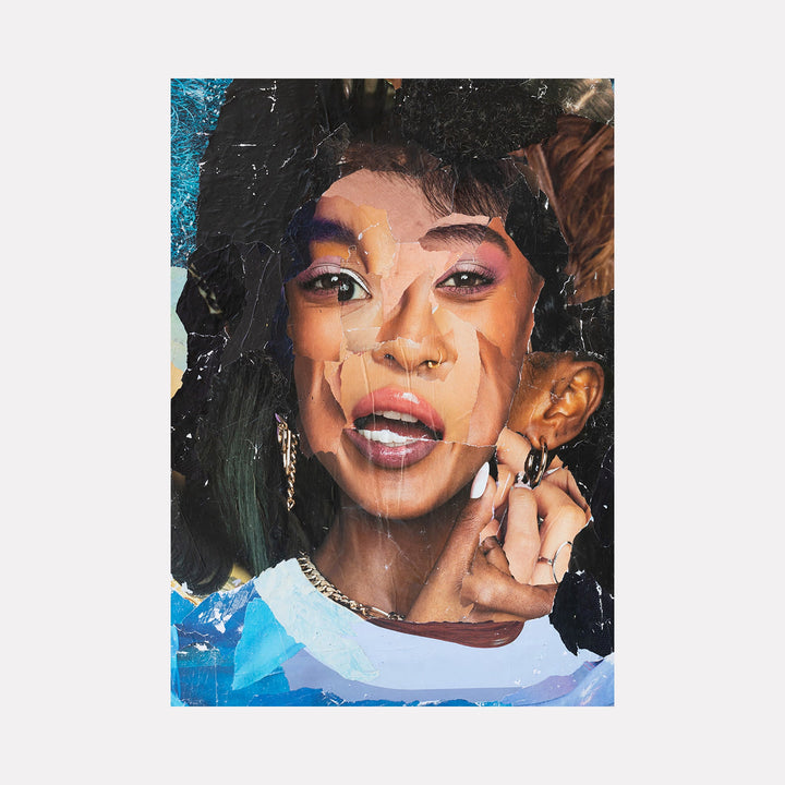 The artwork "Fractal Female" features a layered collage portrait of a woman with vibrant skin tones, blending abstract torn paper textures with smooth, realistic facial features. It showcases a mix of warm browns, purples, and blues, highlighting an artistic fusion of fractal patterns and human expression. By Amy Turner.