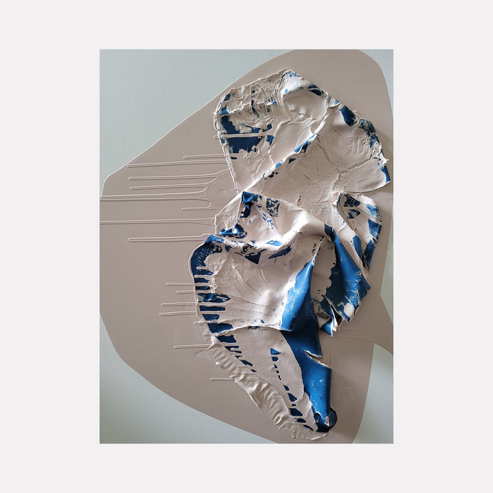 The artwork "Galapagos" by Roger Hsia features a textured abstract form with a combination of smooth and raised surfaces. It showcases a dynamic interplay of beige and deep blue acrylic paint with intricate folds and organic shapes on a 40 by 30-inch canvas, creating depth and movement. Roger Hsia.